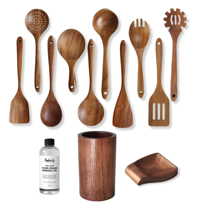 A set of wooden kitchen utensils in various shapes and sizes, including spoons, spatulas, and a wooden cup, displayed alongside a small bottle of Timothy wood oil on a clean white background.