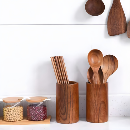 Wooden kitchen utensils and containers on a white background